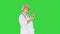 Elder female doctor pressing a buttons on imaginary futuristic screen on a Green Screen, Chroma Key.