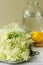 Elder flowers, water, lemon and sugar, ingredients for making elder syrup. Rustic style.