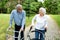 Elder man and a elder woman strolling in the park