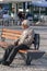 elder man sitting on bench