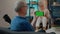 Elder man using horizontal green screen on mobile phone