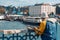 Elder man wearing colorful raincoat fishing at Istanbul