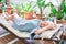 Elder senior woman with grey hair smiling happy resting at the terrace