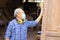 Elder worker wood woodcraft retire hobby for good retirement, Asian male mature professional master of making wooden furniture