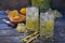Elderberry flowers and lemon drink. Refreshment healthy elder juice. Glass of elderflower lemonade on wooden rustic board. Alterna