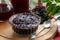Elderberry jam and drink with Sambucus berries on table
