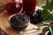 Elderberry jam and drink with Sambucus berries on table, closeup