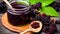 Elderberry jam nestled in a glass jar on a wooden table