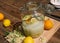 The elderflower liqueur is ready made, all ingredients are in the big preserving jar, fresh elderflowers, oranges and lemon slices