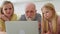 Elderly 70 years old gray-haired old pensioner learns to use modern laptop. Smiling young woman and daughter show an old