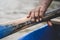 Elderly African-American male rowing a boat on a river