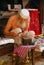 An Elderly Artisan Working on Traditional Handmade Ornament