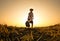 Elderly Asian farmers shoveling and prepare the soil with a spade for planting on sunset background