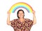 The elderly asian woman smiling while holding colorful rainbow o