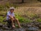 Elderly Australian man sitting by a creek