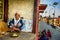 Elderly beggar eats in ancient Pashupatinath Temple complex, Nepal