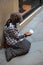 Elderly beggar woman asking for money