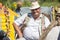 An elderly Belarusian or Ukrainian man wearing a straw hat. Village Slavic inhabitant