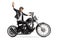 Elderly biker in leather jacket riding a chopper and waving