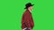 Elderly caucasian cowboy in a hat walking on a Green Screen, Chroma Key.