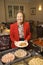 Elderly Caucasian woman in buffet line.