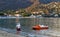 An elderly couple on the beach enjoying the sunset view of the sea and mountains in Le Lavandou, French Riviera.