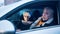 Elderly couple in the car confused with flashing police lights. Speeding ticket