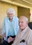 Elderly couple celebrating their 67th wedding anniversary on the back porch of their home.