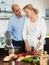 Elderly couple cooking soup