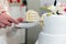 Elderly couple cuts the wedding cake.