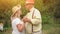 Elderly Couple Dancing In The Garden