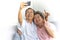 Elderly couple enjoy smartphone selfie. Senior husband and wife smiling taking photo with phone.