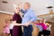 Elderly couple enjoying impassioned merengue in latin dance class