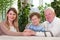 Elderly couple with happy caregiver