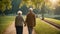 elderly couple holding hands while walking together in park