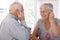 Elderly couple listening to music on mp3 player