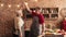 Elderly couple in love holding hands, dancing in kitchen together