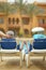 Elderly couple lying by pool