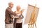 Elderly couple painting together