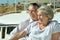 Elderly couple resting on yacht