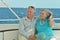 Elderly couple resting on yacht