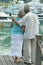 Elderly couple running on beach