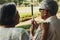 Elderly couple`s caring wife crop-up takes care of the blind couple giving them encouragement, concern, and concern while relaxing