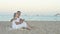 Elderly couple sitting on a beach