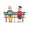 Elderly couple sitting on a bench with gadgets