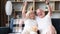 Elderly couple of sports fans watching sports TV games sitting together on the couch