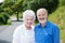 Elderly couple standing in a rural road