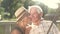 Elderly couple taking romantic photo.