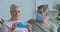 Elderly couple talking wearing medical masks on their old faces, grandfather and grandmother taking care of health