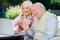 Elderly Couple Video Chatting On Laptop